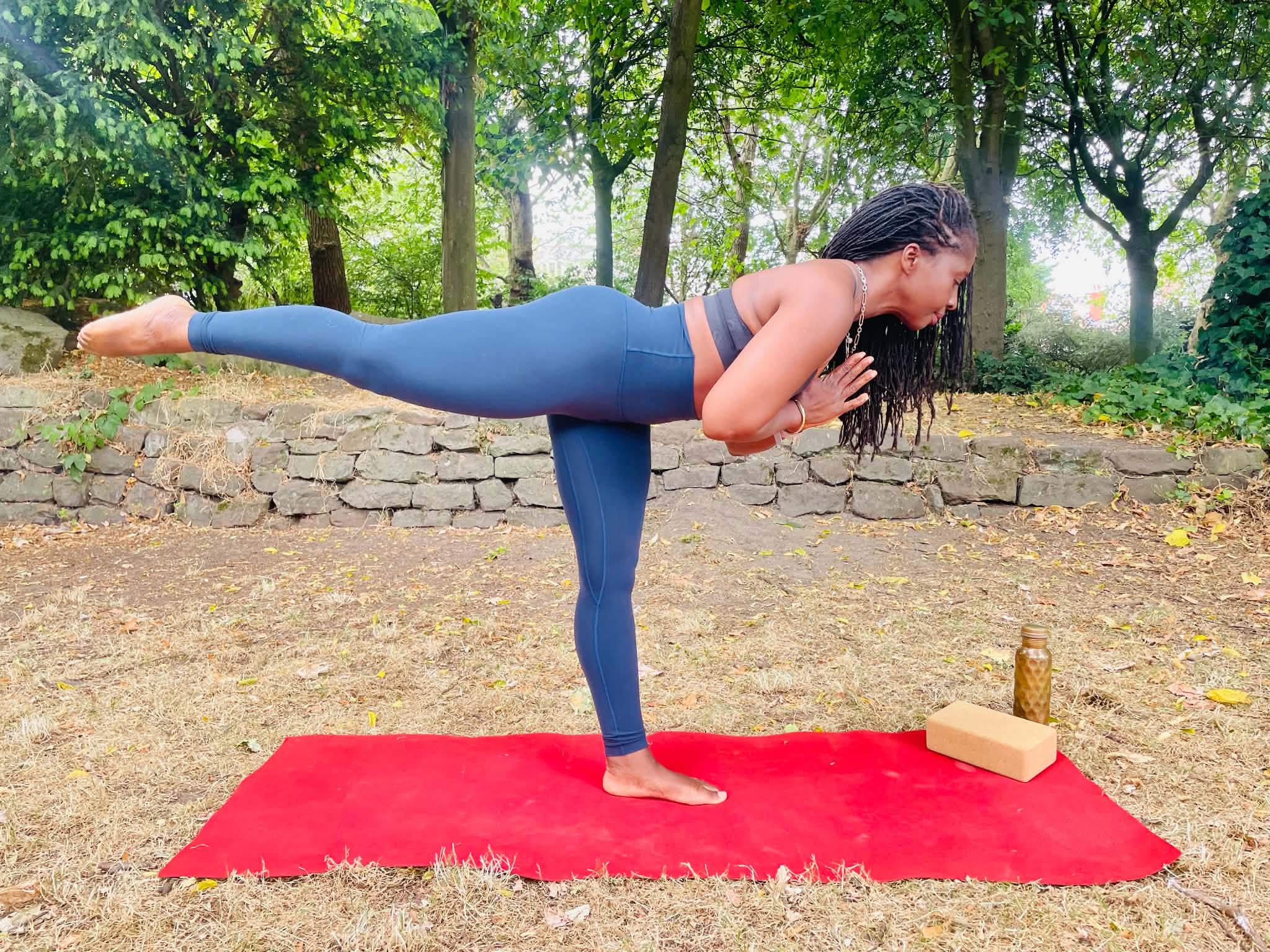 Dionne practising yoga outdoors